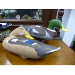 Two similar wooden painted ducks, the bases stamped Walker, the largest 42 cms