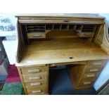 An old oak twin pedestal rolltop desk, 121cms