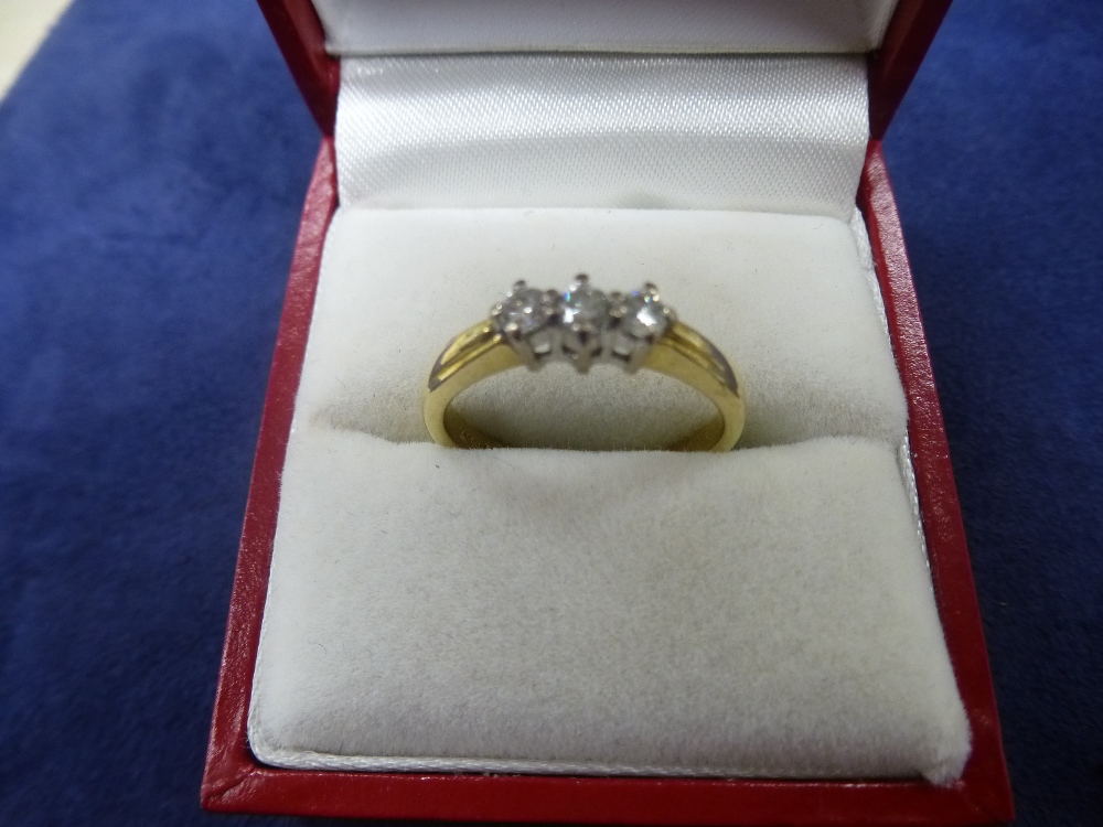 18ct yellow gold ring set with 3 diamonds, size O, marked total item weight 3.4g