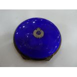 A silver compact hallmarked Birmingham 1864, with a blue enamel outer case and detailed emblem '