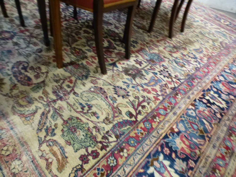 An early 20th century Persian carpet having all over floral design, blue bordered, 373 x 325 cms and - Image 3 of 4