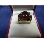 Hallmarked 9ct gold garnet cluster ring, size P, total gross weight approx 4.8g