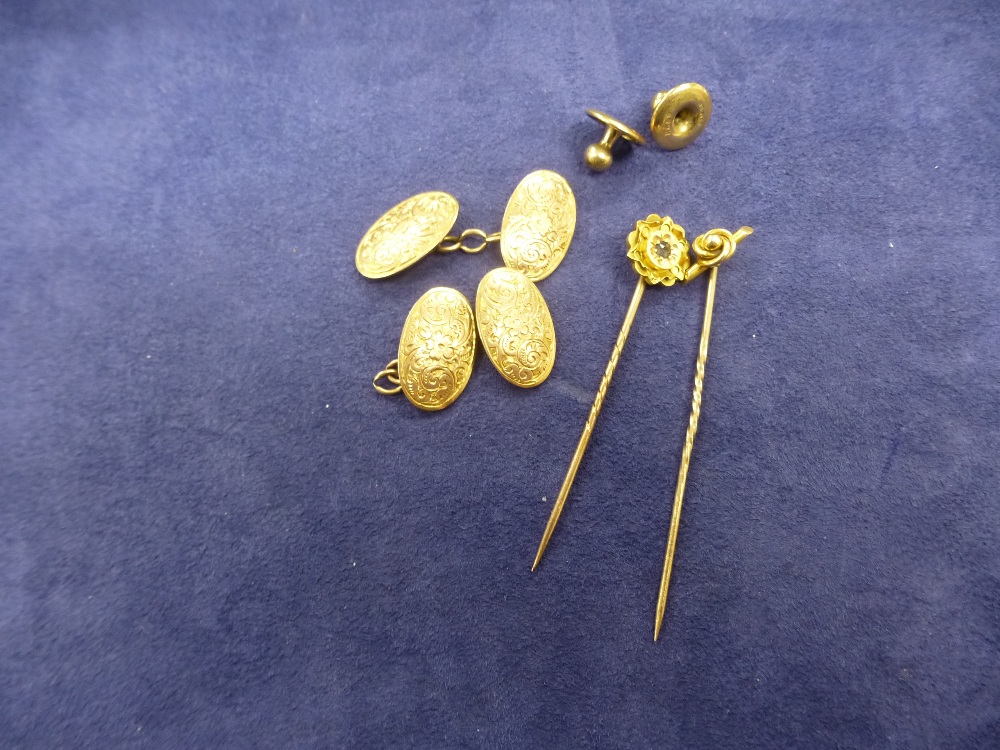 Hallmarked 9ct cufflinks weight 5.4g approx, broken chain on one cufflink, two 15ct gold stick