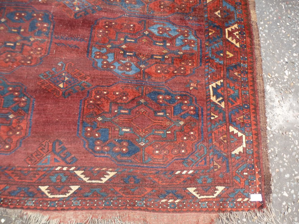 An Afghan rug, having three rows of medallions and one other Caucasian rug, the largest 248 x 208cms - Image 2 of 3