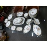 A quantity of Continental dinnerware, decorated flowers, probably German