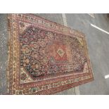 A Caucasian rug having square central panel, cream bordered, 237 x 173 cms