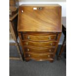 A Reproduction mahogany ladies bureau, having four drawers, 56 cms