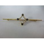 15ct yellow gold bar brooch inset with seed pearls and sapphires, marked 14ct and pin marked 9ct,