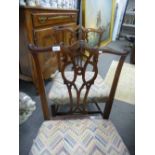 A pair of Georgian mahogany dining chairs with pierced splats on square chamfered legs