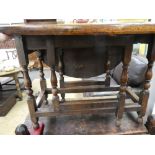 An antique oak gateleg table having one drawer on turned legs 106.5cms