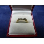 Yellow metal 5 stone diamond ring, size S/T, total item weight approx 2.1g