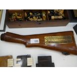 A Victorian mahogany games box and a cribbage board made from a gun butt