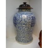 A 20th century Chinese blue and white vase with hardwood lid 36cms - without lid
