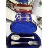 A silver cased fork and apoon London 1895 weight 1.4oz, set of six cased teaspoons. Also a silver