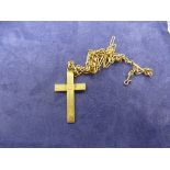 Yellow coloured metal neckchain, unmarked, and a 9ct yellow gold cross pendant, stamped 9ct, total