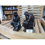 A pair of antique bronze figural bookends of seated scholars, one signed A.B.