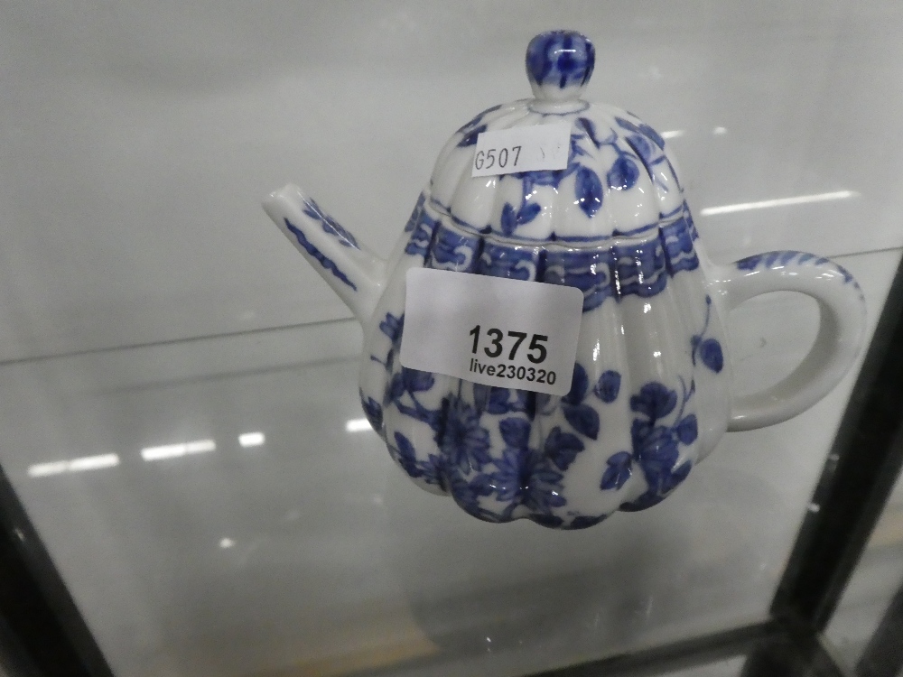 A small Chinese blue and white teapot having floral decoration