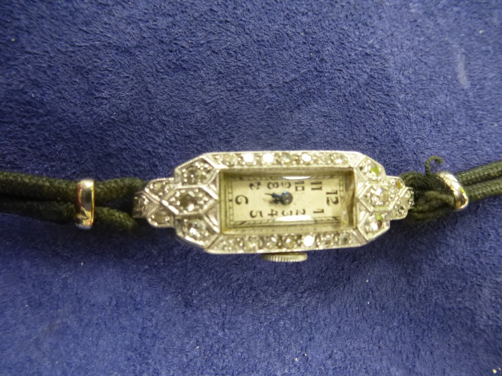 Art Deco platinum & diamond cocktail watch, case stamped PLATINUM LONDON MAKE, on a black fabric