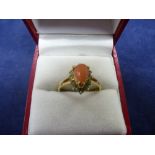18K yellow gold dress ring set with tear shaped coral stone and surrounded by clear stones, size P/Q