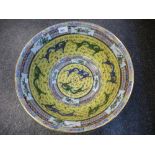 A Large 20th Century Chinese bowl yellow ground and decorated with dragons 40.5cms