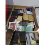 A quantity of 19th century and later playing cards, some in leather card cases