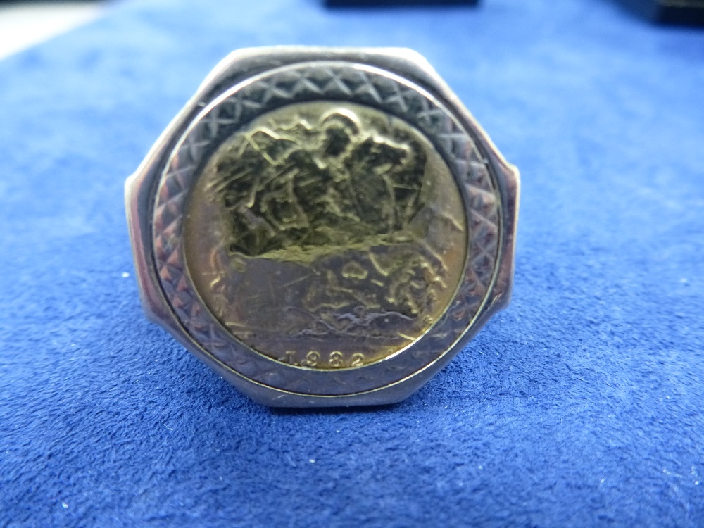 Gents half sovereign ring set with half sovereign dated 1982, on a 9ct gold shank stamped 375