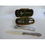 Victorian four piece manicure set having silver handles in fitted case, a letter knife having