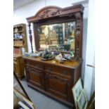 An early 20th century carved oak mirror back sideboard with turned supports, 153 cms