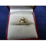 9ct yellow gold ring set with 3 seed pearls, marked 375, size N, total item weight 2.1g