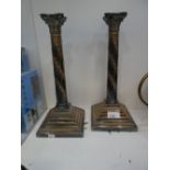 A pair of Corinthian column silver plated candlesticks, 33 cms