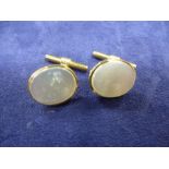Pair of 9ct gold cufflinks set with mother of pearl - marked 375 and another