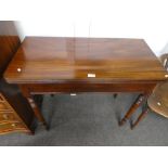 A Victorian mahogany foldover tea table on turned legs and one other similar card table