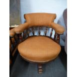 A Victorian revolving desk armchair having spindleback