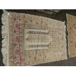 A Turkish style prayer rug, having stylised design, 157 x 116 cms