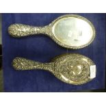 A dressing table brush and mirror silver hallmarked and of embossed design AF