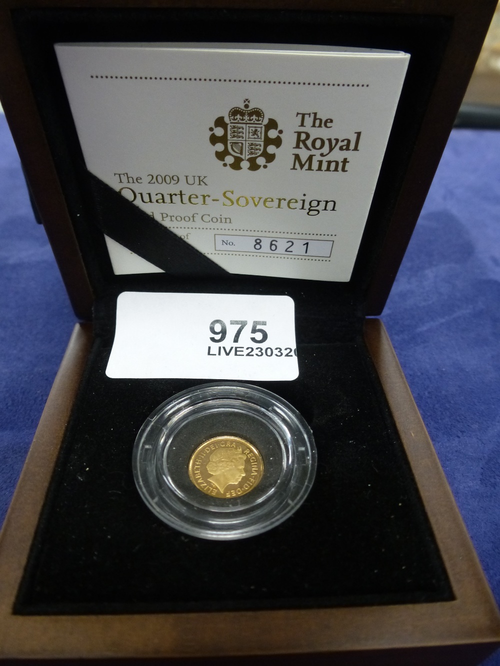 Boxed quarter Sovereign gold proof coin, dated 2009 and Certificate of Authenticity