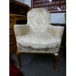 A Reproduction Queen Anne style armchair on cabriole legs