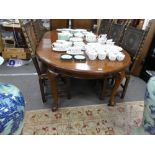 An early 20th century mahogany oval dining extending table having two leaves on cabriole legs,