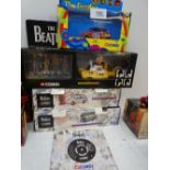 A Corgi Beatles Yellow submarine, a Psychedelic Mini and a double decker bus, all mint unused