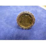 Gents 9ct gold ring set with half sovereign dated 1982, shank stamped 375, total weight approx 8g,