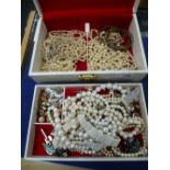 Cream jewellery box containing costume jewellery, pear neckless, bangles, tiger brooch, earrings,
