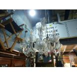 Waterford; a crystal glass chandelier with pendant drops, each marked Waterford