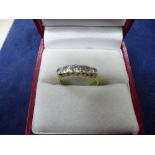 Yellow metal ring - 5 stone diamond ring on a yellow metal shank, total weight 2.2g, size J,