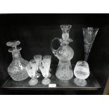 A Stuart crystal decanter with six matching glasses, an Edinburgh Thistle decanter with brandy glass