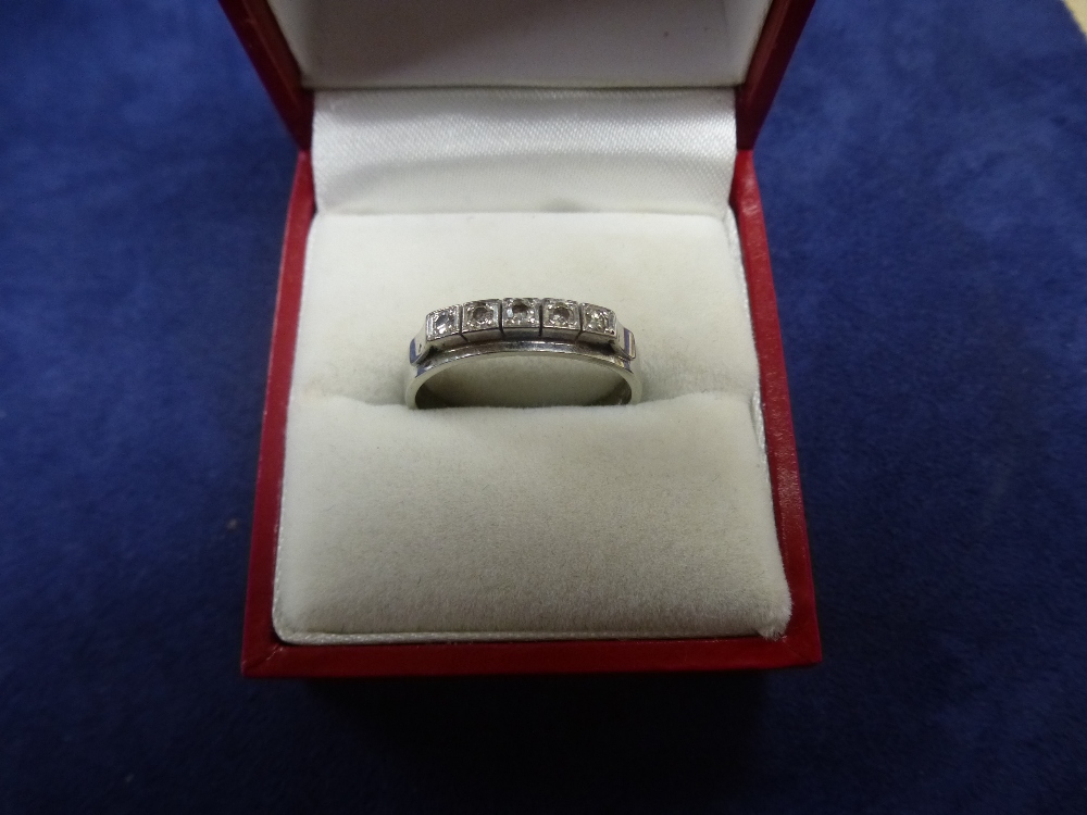 18ct white gold ring set with 5 small diamonds, marked 18ct, size Q/R, total item weight 3.9g