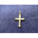 9K yellow and white gold cross inset with diamond chips, approx 3.5cm long, total weight 3g