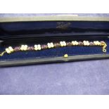 Good quality 18ct yellow gold bracelet set with cabochon amethysts, cultured pearls a small garnets,