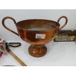 A copper two handled pedestal bowl made from the Portsmouth United Brewery 1897 - 1963