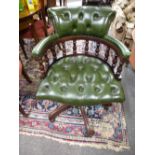 A reproduction revolving desk chair having buttoned upholstery