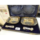 A pair of silver Bon Bon dishes and 2 pairs of tongs in their original case, hallmarked Sheffield